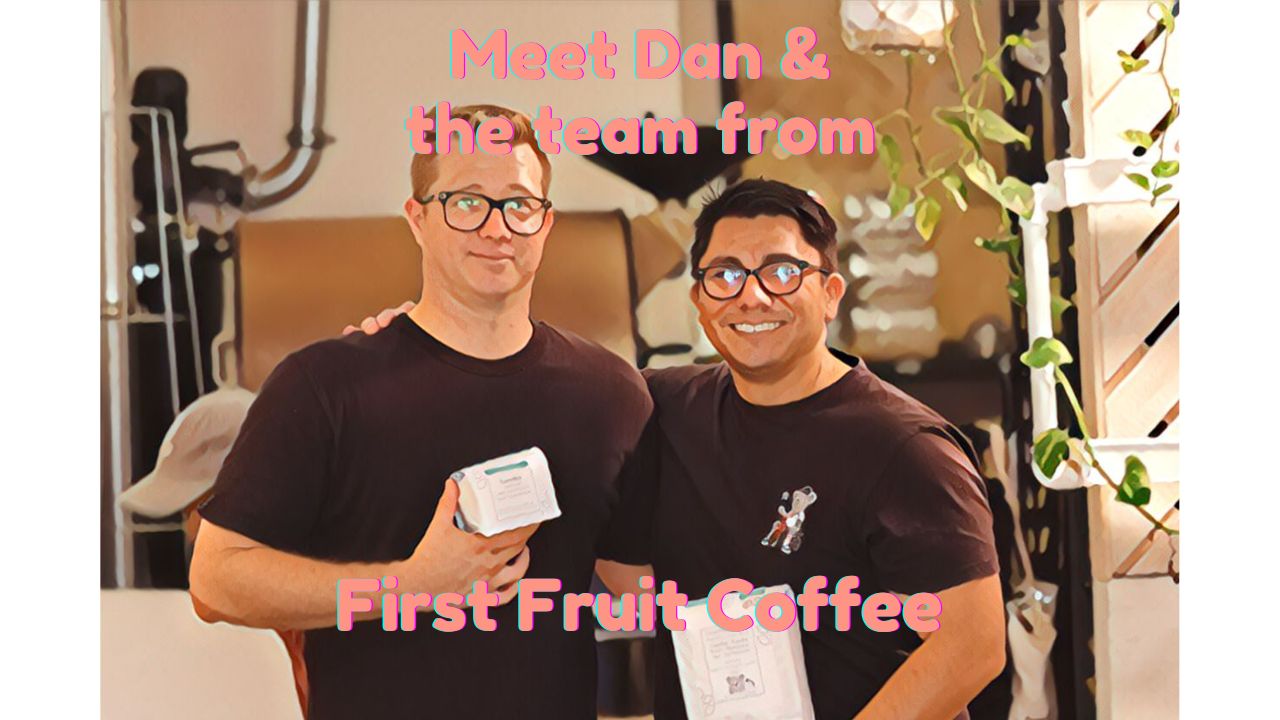 Picture of Dan Smith holding a coffee with Tommy holding a coffee